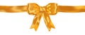 Shiny satin gold ribbon bow isolated on white Royalty Free Stock Photo
