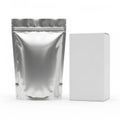 A shiny silver foil pouch and a white rectangular box on a plain white background Royalty Free Stock Photo