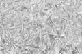 Shiny silver foil texture background, pattern of white grey wrapping paper with crumpled and wavy Royalty Free Stock Photo