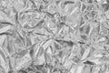 Shiny silver foil texture background, pattern of white grey wrapping paper with crumpled and wavy Royalty Free Stock Photo