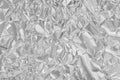 Shiny silver foil texture background, pattern of wrapping paper with crumpled and wavy Royalty Free Stock Photo