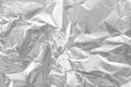 Shiny silver foil texture background, pattern of wrapping paper with crumpled and wavy Royalty Free Stock Photo