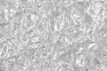 Shiny silver foil texture background, pattern of wrapping paper with crumpled and wavy Royalty Free Stock Photo