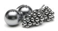 Shiny silver spheres and grape cluster on white surface still life Royalty Free Stock Photo