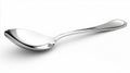 Shiny silver spoon lying on a white background Royalty Free Stock Photo