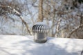 Whirlybird Air Vent on a Snowed-Over Roof Royalty Free Stock Photo
