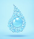 Shiny spheres in the shape of a water drop on blue background Royalty Free Stock Photo