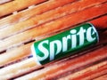 Shiny Sprite can on an old bamboo background, green aluminum can from a popular soft drink brand