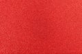 Shiny surface. Red glitter texture. Christmas abstract background, defocused Royalty Free Stock Photo