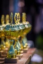 Shiny trophies line up on the table Royalty Free Stock Photo