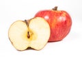 A shiny, whole apple and a half of an apple Royalty Free Stock Photo