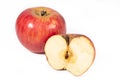 A shiny, whole apple and a half of an apple Royalty Free Stock Photo