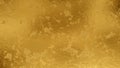 Shiny wrinkled gold foil texture. Scratched metal background. Royalty Free Stock Photo