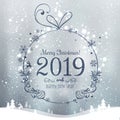 Shiny Xmas ball for Merry Christmas 2019 and New Year on holidays background with winter landscape with snowflakes, light, stars. Royalty Free Stock Photo