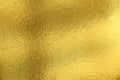 Shiny yellow leaf gold foil texture background Royalty Free Stock Photo