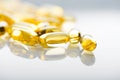 Shiny yellow vitamin e fish oil capsule Royalty Free Stock Photo