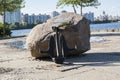 Ship anchor near the stone Royalty Free Stock Photo