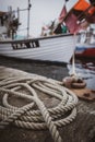 a ship is attached to a bollard in the harbor Royalty Free Stock Photo