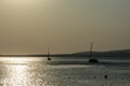 A ship on a background of a silver calm Black Sea at sunset. The sunny path on the water makes the landscape peaceful Royalty Free Stock Photo