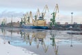 The ship Baltic spring is unloaded at the cargo port, february morning. The Gunboat canal, Saint Petersburg