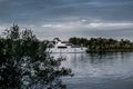 A ship, a barge, a yacht, a boat on the river in the Rostov region. Water transport against the background of a green leafy landsc Royalty Free Stock Photo