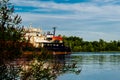 A ship, a barge, a yacht, a boat on the river in the Rostov region. Water transport against the background of a green leafy landsc Royalty Free Stock Photo