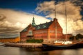 Ship at berth on water next to shipbuilding plant