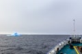 Ship bow and Iceberg drifting at Lemaire Channel Royalty Free Stock Photo