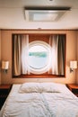 Ship Cabin With Bed And Window With View On Sea. Luxury Cabin On Ferry Boat Or Cruise Liner. Royalty Free Stock Photo