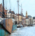 Ship in a canal in a city in winter