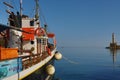 Ship in Chania Harbor with Lighthouse