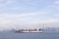 Ship with colorful containers in harbor near new york with blue Royalty Free Stock Photo