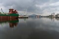 Ship with crane working collecting metal debris from the basque country industry