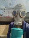 Ship crew wearing oxygen mask and preparing for entering the hatch for inspection