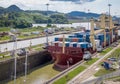 Ship crossing Panama Canal being lowered at Miraflores Locks - Panama City, Panama Royalty Free Stock Photo