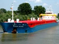 Ship on the Danube Delta channel. Royalty Free Stock Photo