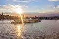 Ship on the Danube River in Budapest Hungary in the rays of the sun