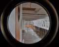 Ship deck view through round window. Royalty Free Stock Photo