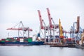 Ship in the dock with elevating cranes Royalty Free Stock Photo