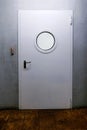 Ship door with porthole. Royalty Free Stock Photo