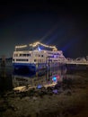 Ship at the edge of the sea port at night. Royalty Free Stock Photo