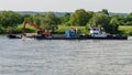 Ship with excavator deepening the bottom of the river. Royalty Free Stock Photo