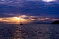 Ship floating on rippled water on Lake Baikal at sunset, Siberia, Russia Royalty Free Stock Photo