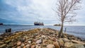 Ship on the foreland with rocks, gunboat island 05 may 2018 Royalty Free Stock Photo