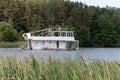 Minsk. Belarus. 07.27.2022. A ship in the form of a two-story houseboat floats along the river.