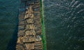 Ship freighting timber passing under a bridge.. Royalty Free Stock Photo