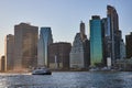 Ship going down river in New York City with skyline in background viewed from Brooklyn Royalty Free Stock Photo