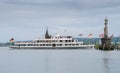 The ship and lighthouse (Imperia statue) at the entrance of the harbour of Constance, Germany Royalty Free Stock Photo