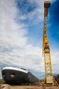 Ship and monumental crane in the shipyard Royalty Free Stock Photo