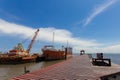 Ship and monumental crane in the shipyard. Royalty Free Stock Photo